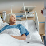 senior hospital patient in bed