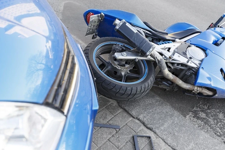 Car knocked over motorycle